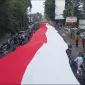 Bendera berukuran 100 meter diarak di sepanjang Kota Bogor